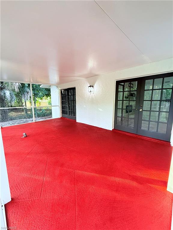 3330 13th Avenue Southwest Naples, FL 34117 - Photo 15 of 50 a bed room with a bed and a large window