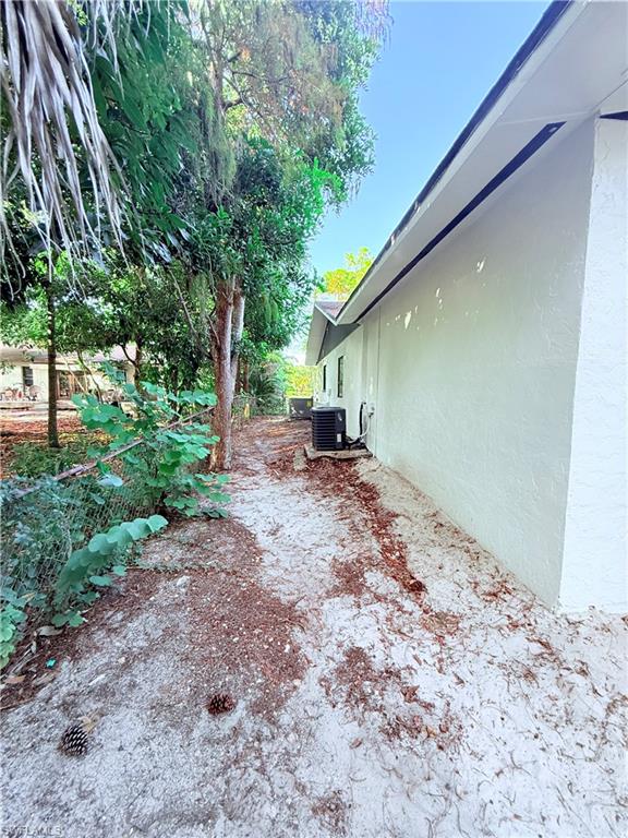 3330 13th Avenue Southwest Naples, FL 34117 - Photo 16 of 50 a backyard of a house with lots of green space