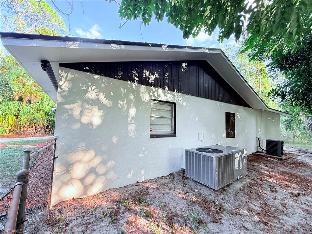 3330 13th Avenue Southwest Naples, FL 34117 - Photo 17 of 50 a backyard of a house with yard and garage