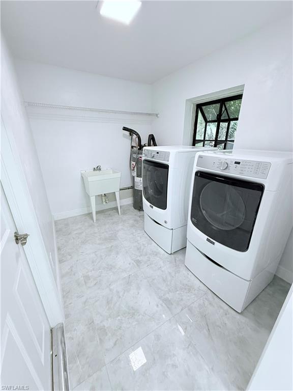 3330 13th Avenue Southwest Naples, FL 34117 - Photo 22 of 50 a utility room with dryer and washer