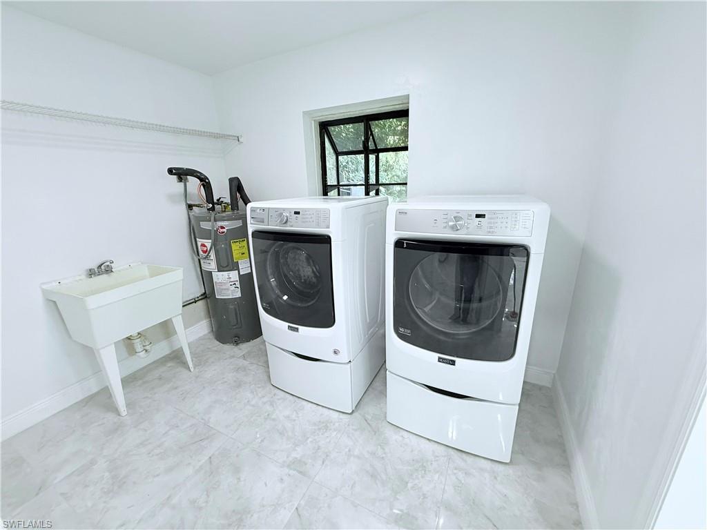 3330 13th Avenue Southwest Naples, FL 34117 - Photo 23 of 50 a utility room with dryer and washer