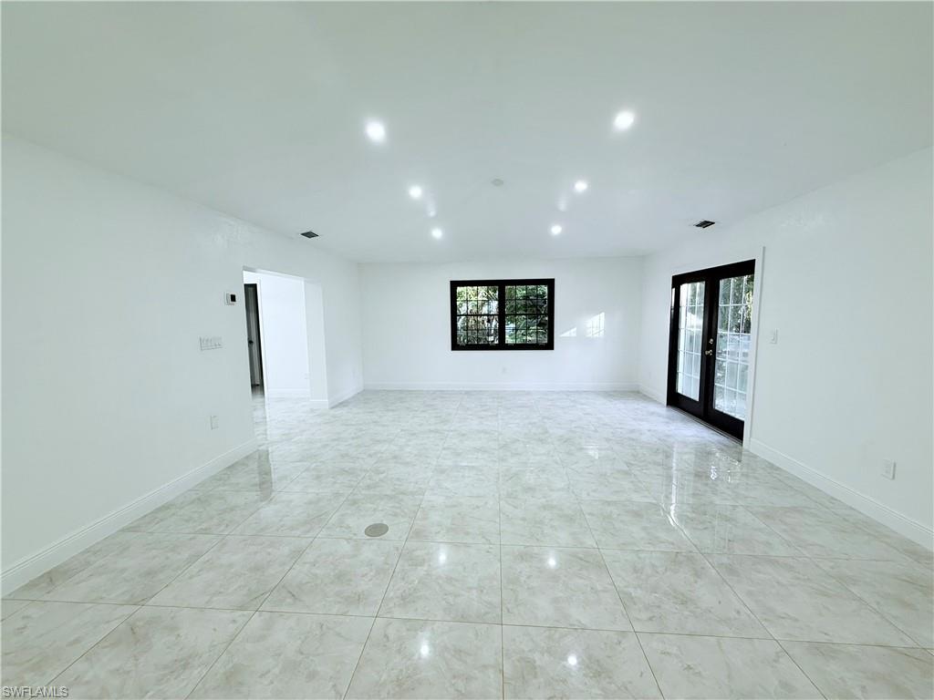 3330 13th Avenue Southwest Naples, FL 34117 - Photo 28 of 50 a view of an empty room with a window