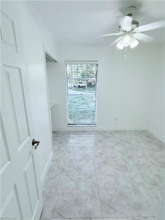 3330 13th Avenue Southwest Naples, FL 34117 - Photo 34 of 50 a view of an empty room with a window