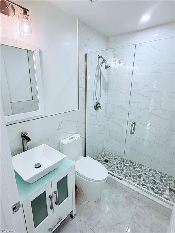 3330 13th Avenue Southwest Naples, FL 34117 - Photo 39 of 50 a bathroom with a sink a toilet and shower