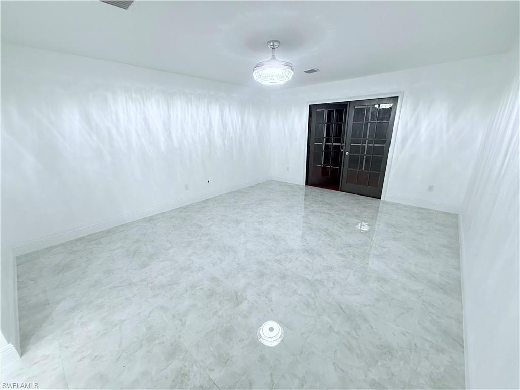 3330 13th Avenue Southwest Naples, FL 34117 - Photo 47 of 50 an empty room with closet and windows