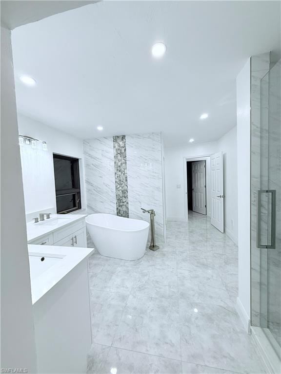 3330 13th Avenue Southwest Naples, FL 34117 - Photo 48 of 50 a living room with furniture and a flat screen tv