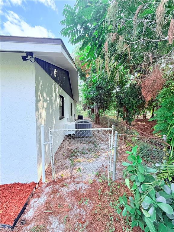 3330 13th Avenue Southwest Naples, FL 34117 - Photo 5 of 50 a view of a house with a yard