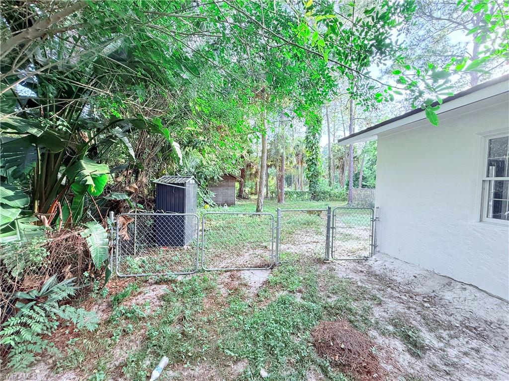 3330 13th Avenue Southwest Naples, FL 34117 - Photo 8 of 50 a view of a backyard with a garden