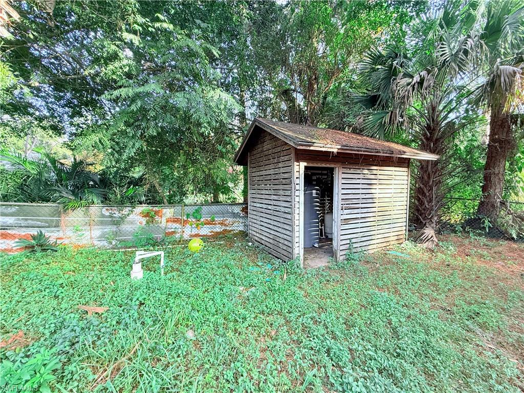 3330 13th Avenue Southwest Naples, FL 34117 - Photo 10 of 50 a backyard of a house with lots of green space