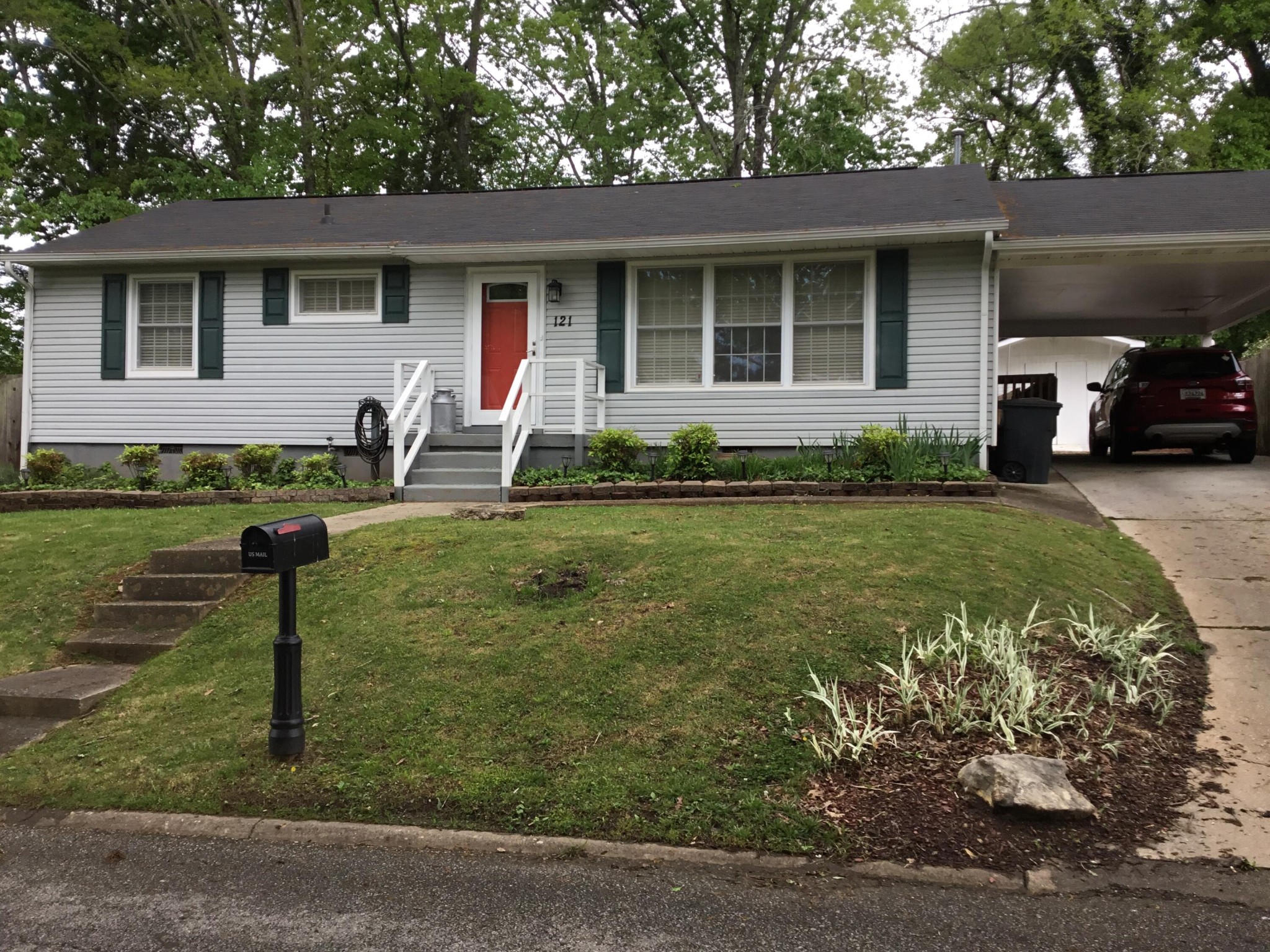 121 East Arrowwood Road Oak Ridge, TN 37830 - Photo 1 of 26 a front view of a house with garden