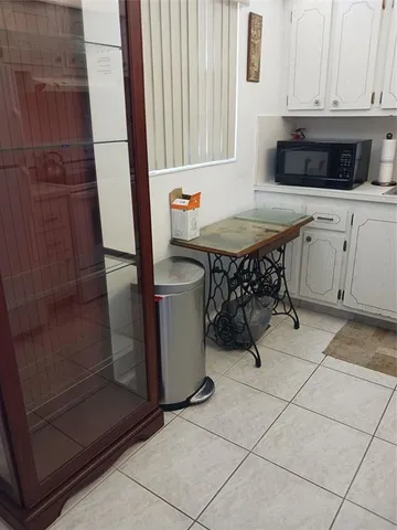a kitchen with stainless steel appliances a stove a sink and a microwave