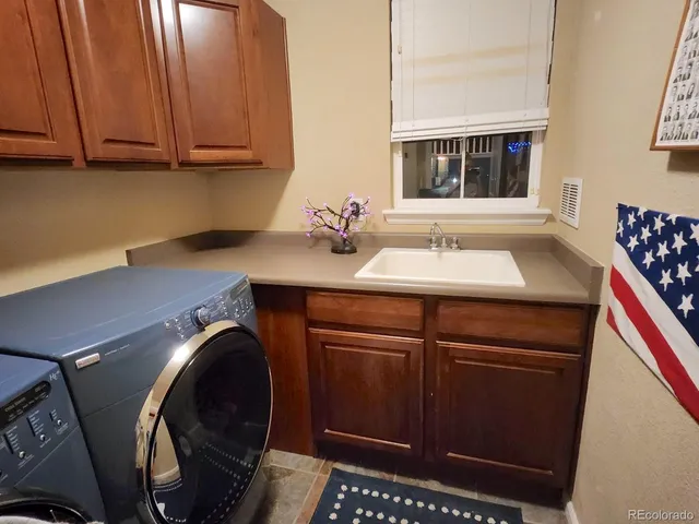 a bathroom with a sink a tub and a mirror