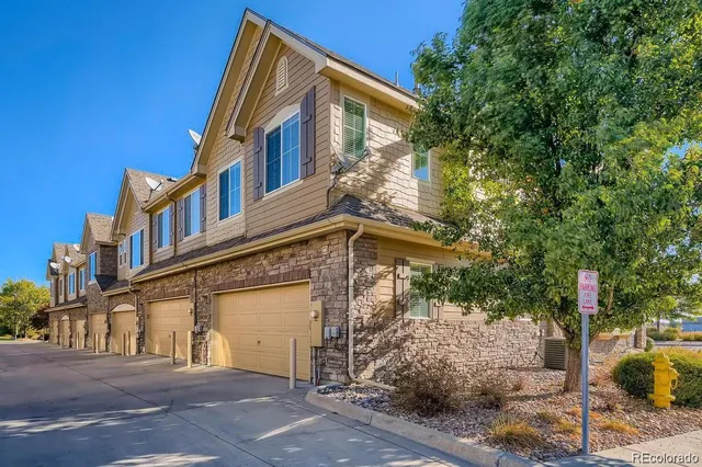a view of a house with a tree