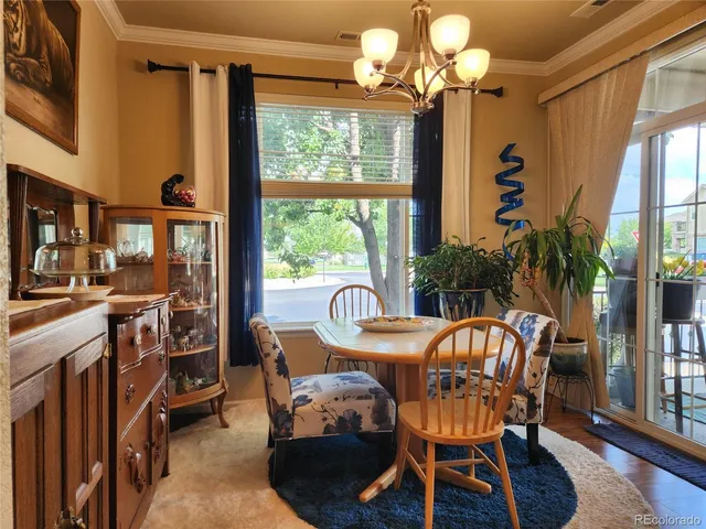 a kitchen with kitchen island granite countertop a sink and a stove