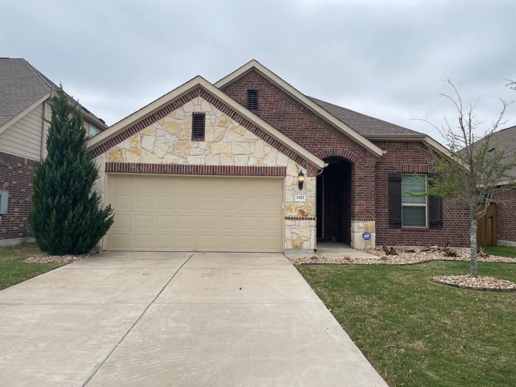 3421 Grail Hollows Road Pflugerville, TX 78660 - Photo 1 of 1 a front view of house with garden