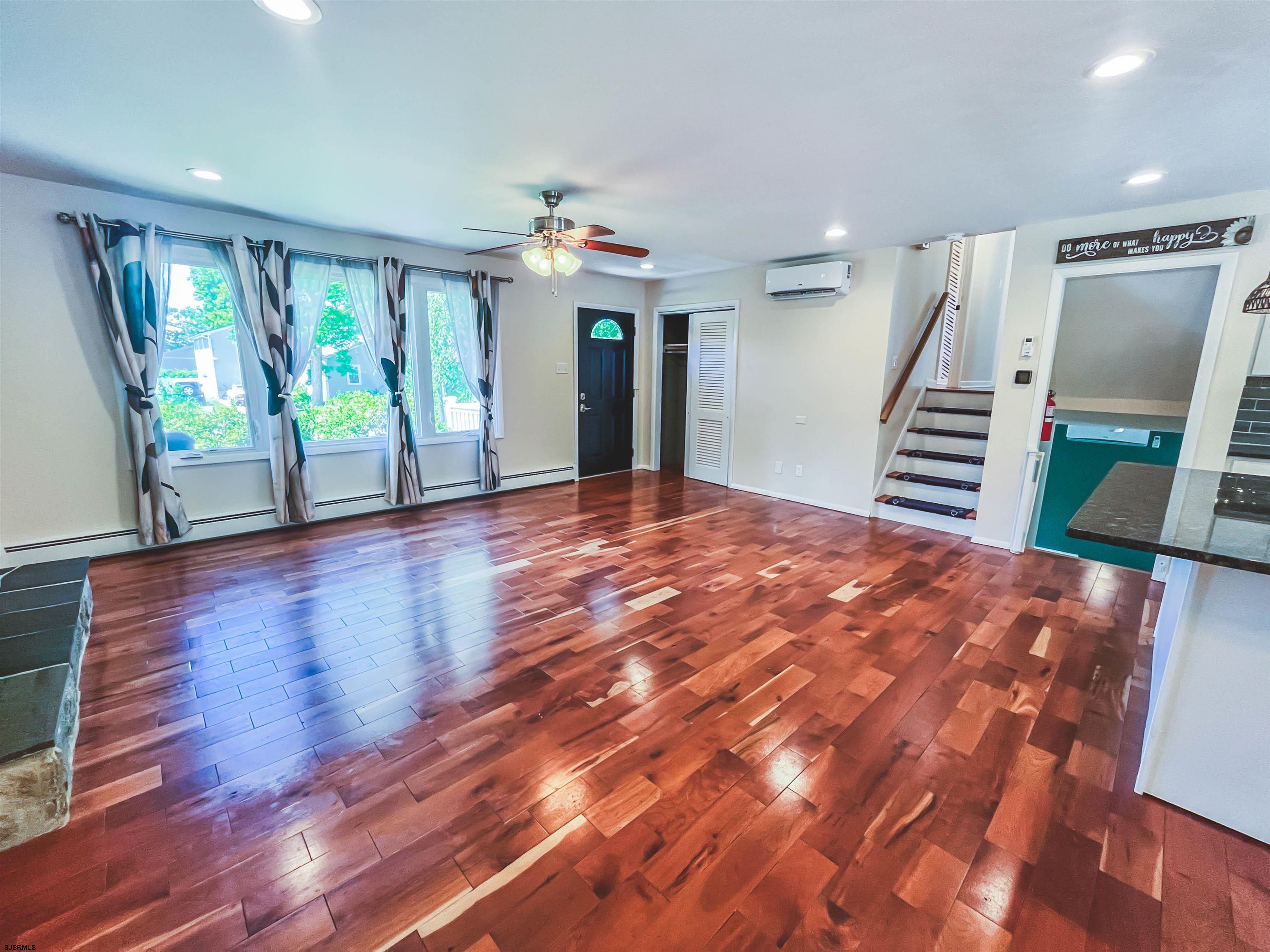 518 Delaware Avenue Absecon, NJ 08201 - Photo 5 of 38 a view of an empty room with wooden floor and a window