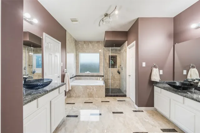 a kitchen with granite countertop a sink and a refrigerator