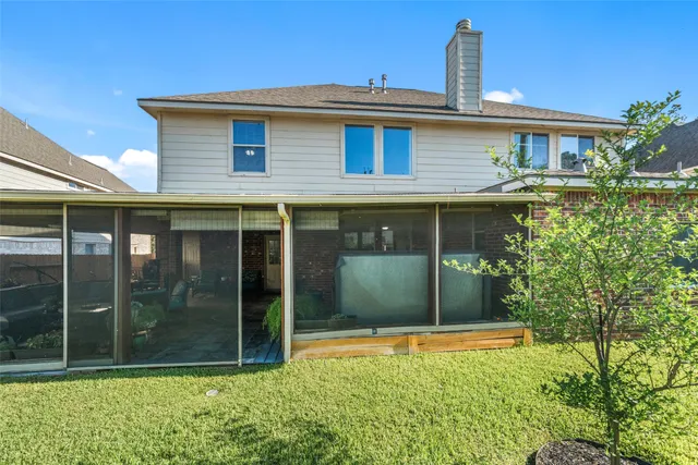 an aerial view of a house with a lake view