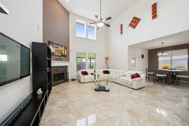 a living room with fireplace furniture and a flat screen tv