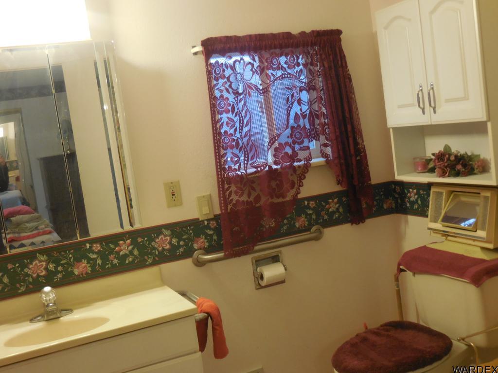 708 Ocotillo Lane Quartzsite, AZ 85346 - Photo 15 of 17 a bathroom with a sink and a mirror
