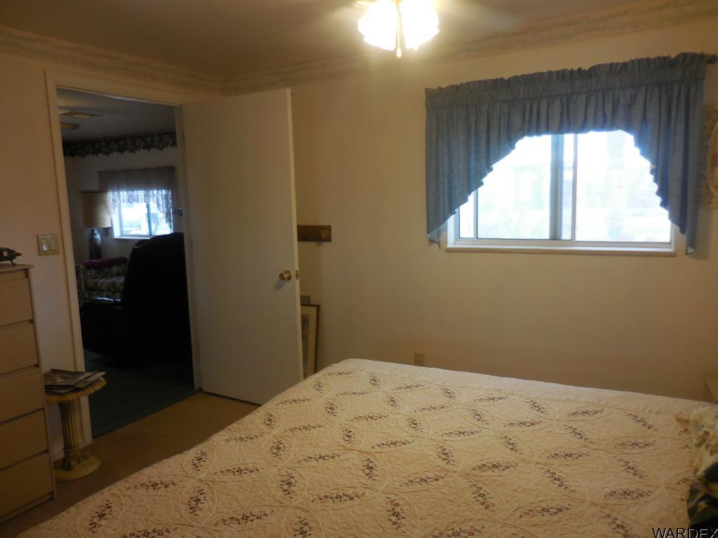 708 Ocotillo Lane Quartzsite, AZ 85346 - Photo 16 of 17 a bedroom with a bed and a window