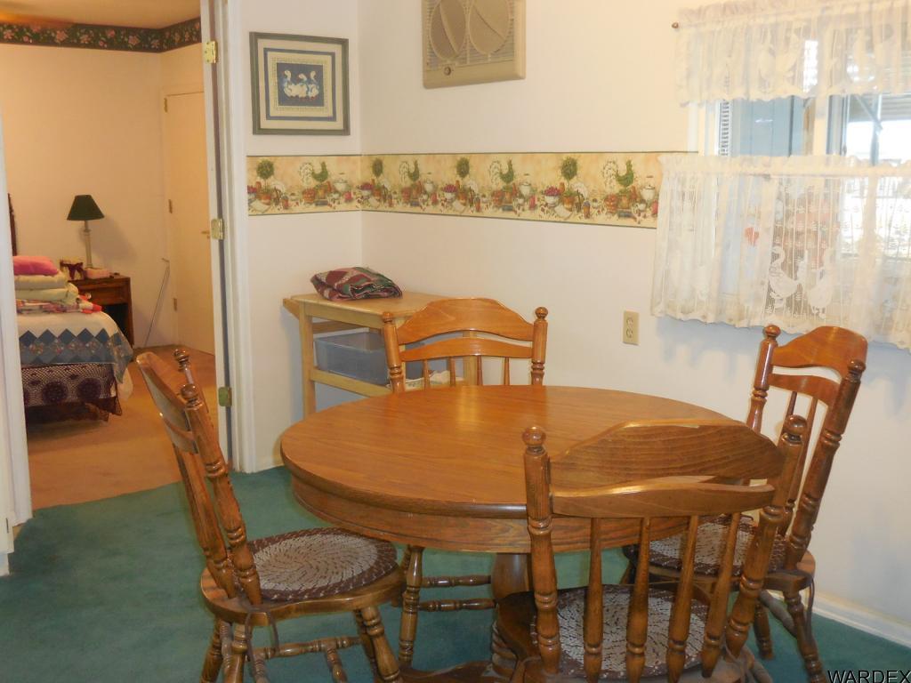 708 Ocotillo Lane Quartzsite, AZ 85346 - Photo 10 of 17 a dining table with chairs and table