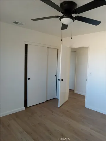 an empty room with fan