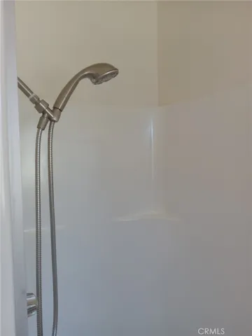 a room with washing machine and window