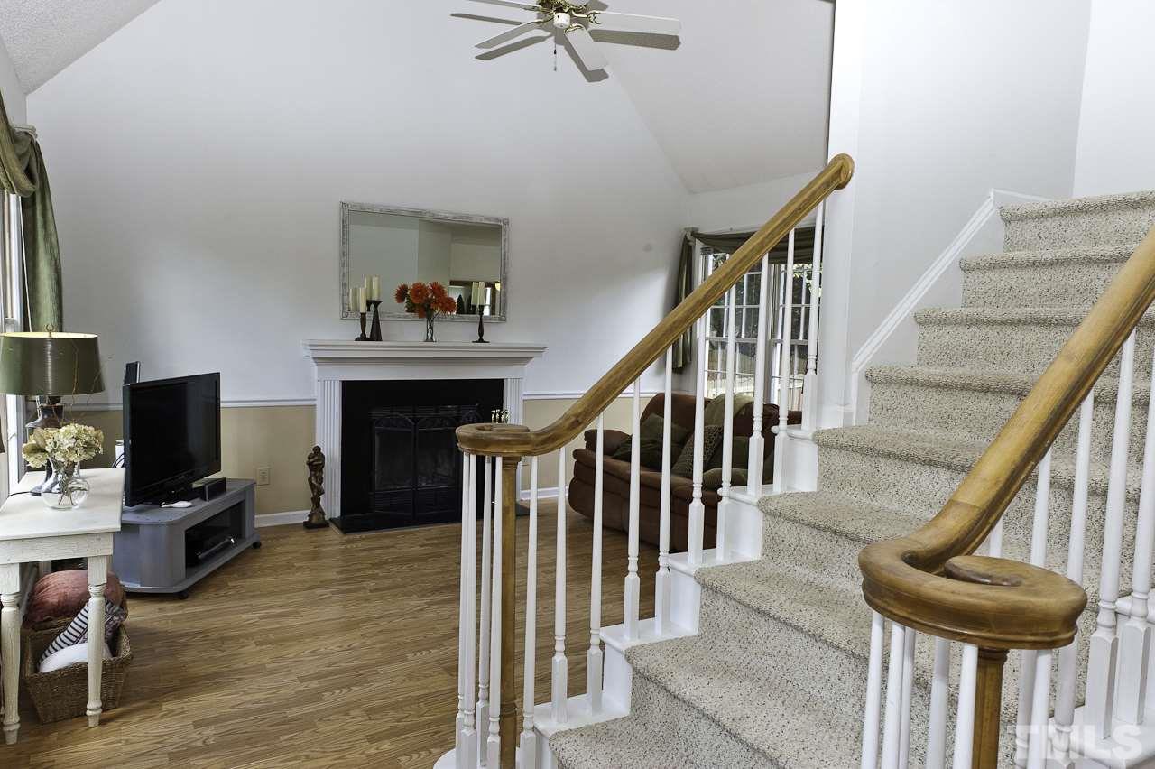 4517 Birmingham Way Raleigh, NC 27604 - Photo 13 of 25 a view of entryway and hall with wooden floor