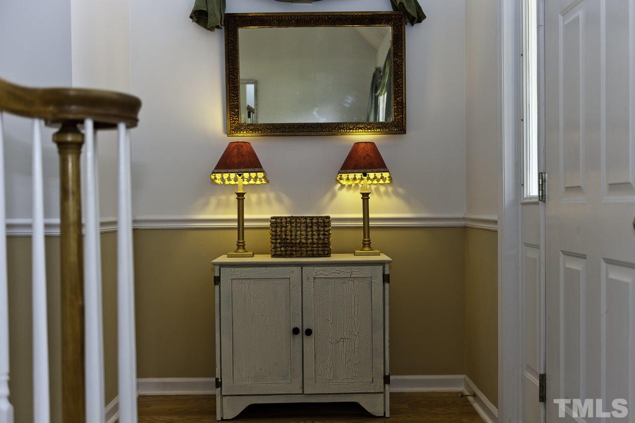 4517 Birmingham Way Raleigh, NC 27604 - Photo 3 of 25 a bathroom with a sink and mirror