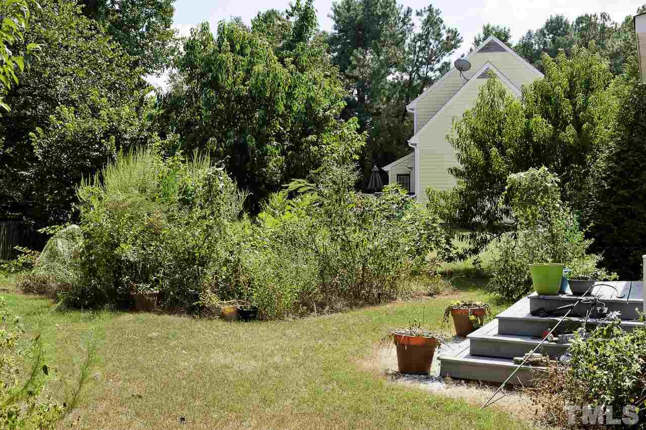 4517 Birmingham Way Raleigh, NC 27604 - Photo 25 of 25 a backyard of a house with lots of green space