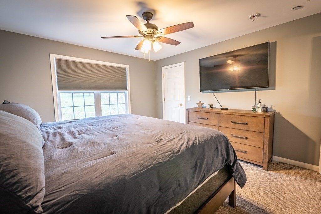 1084 Pine Street, Unit 2 Fall River, MA 02723 - Photo 19 of 22 a bedroom with a bed and a flat screen tv