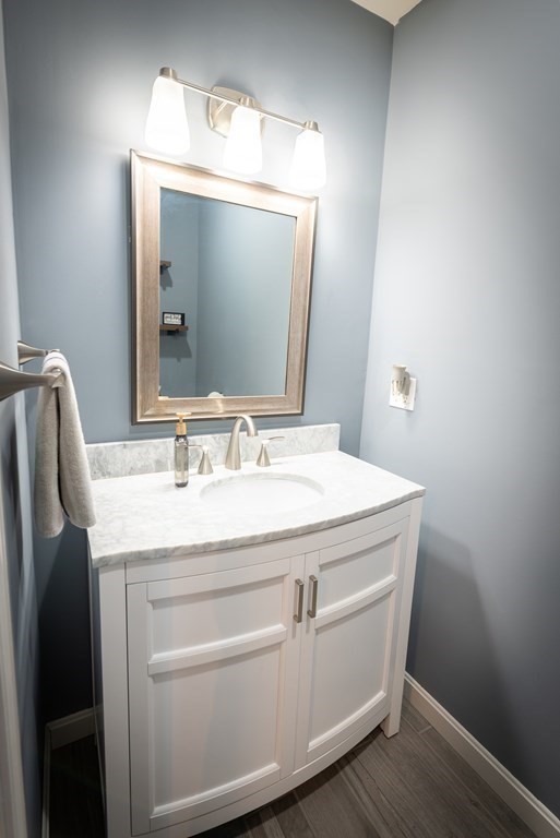 1084 Pine Street, Unit 2 Fall River, MA 02723 - Photo 10 of 22 a bathroom with a sink and a mirror