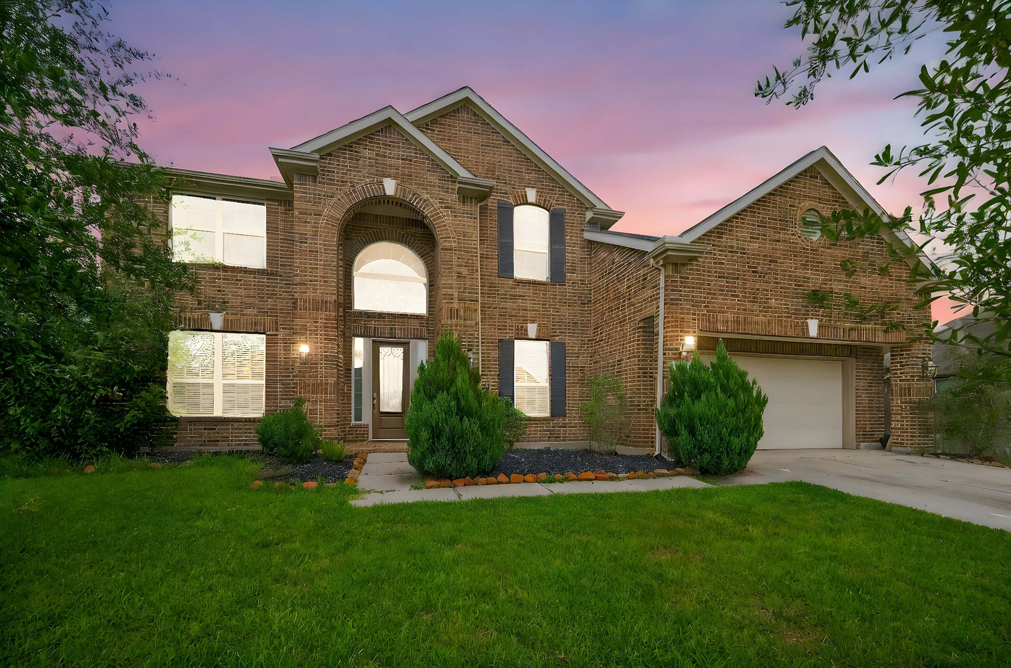 a front view of a house with garden