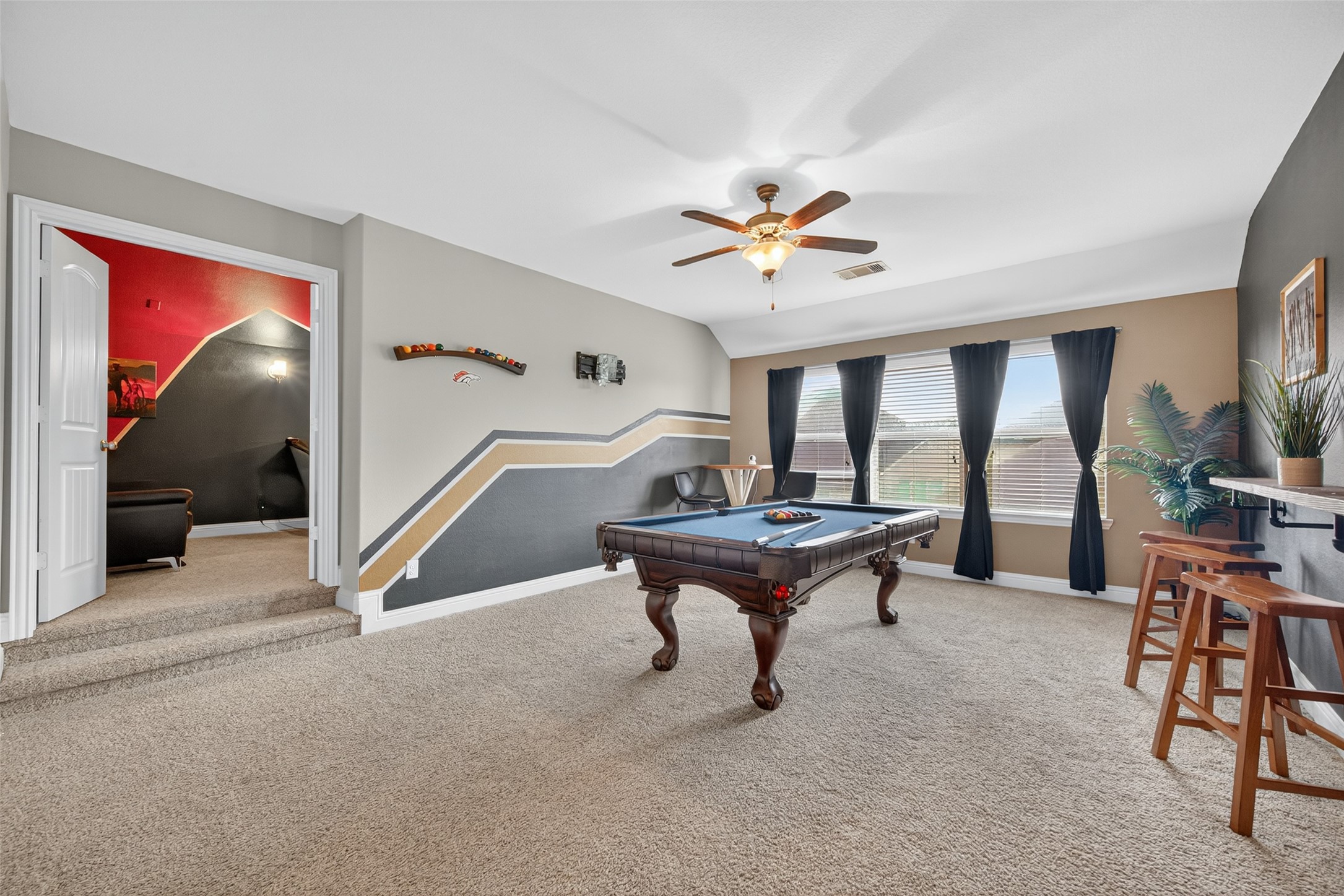 4719 Prairie Springs Lane Rosharon, TX 77583 - Photo 21 of 33 a living room with furniture a rug and a large window