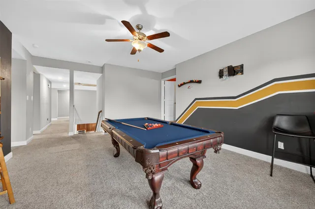 a room with wooden floor and furniture