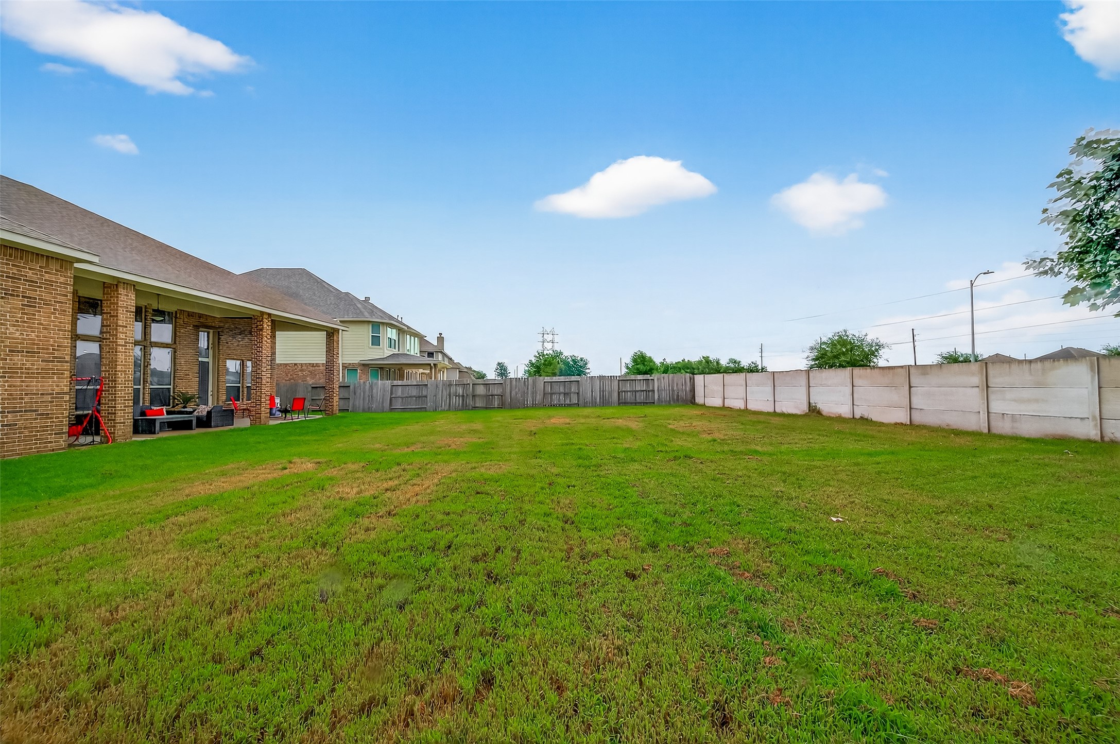 4719 Prairie Springs Lane Rosharon, TX 77583 - Photo 32 of 33 a view of a house with a backyard