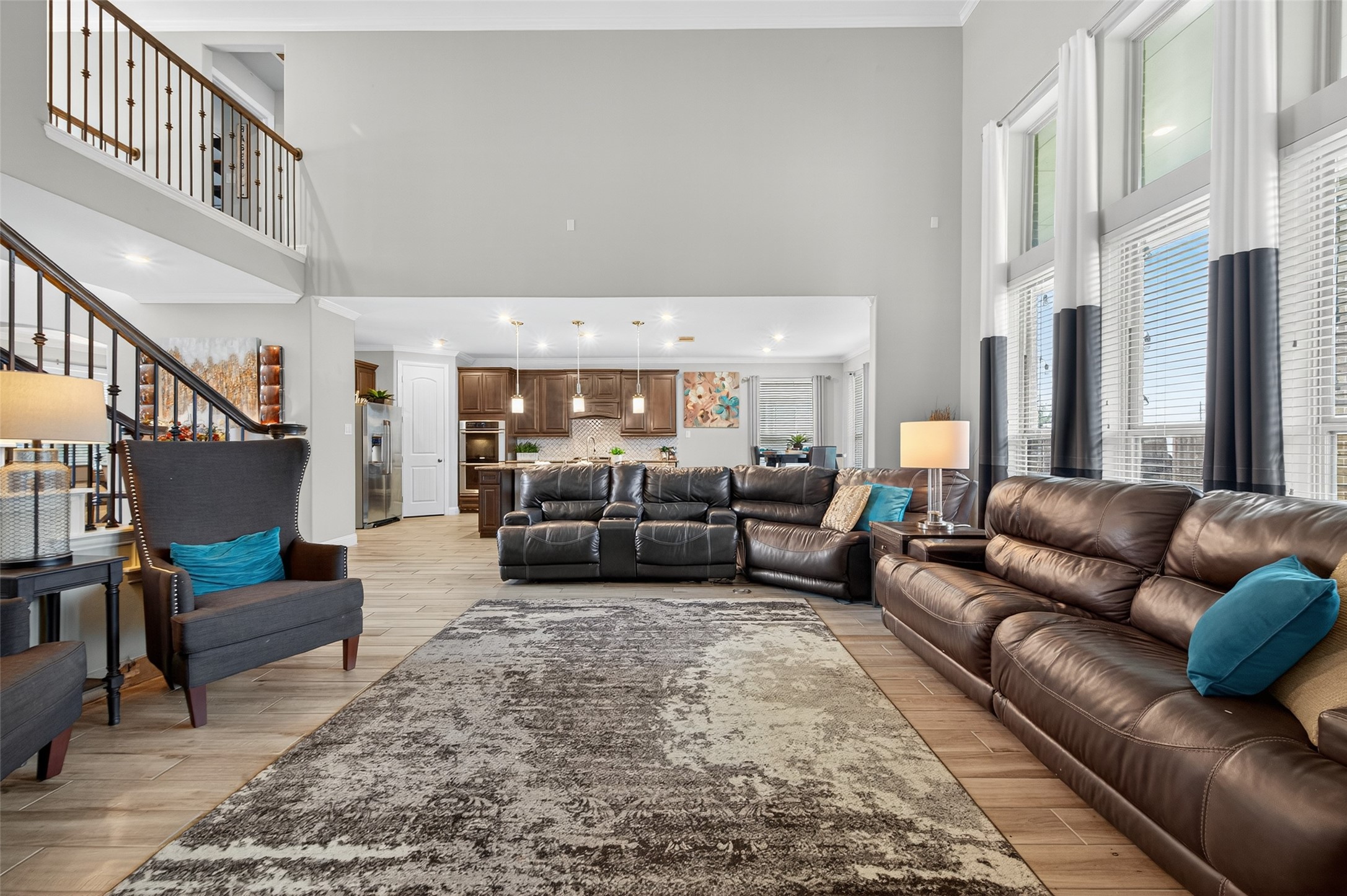 4719 Prairie Springs Lane Rosharon, TX 77583 - Photo 9 of 33 a living room with furniture kitchen view and a large window
