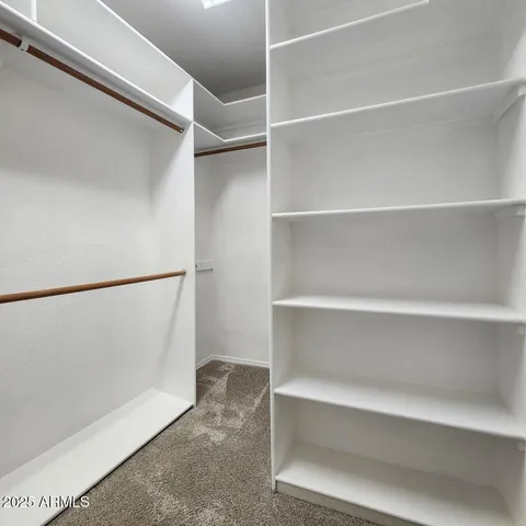 a bathroom with double vanity sinks and a mirror