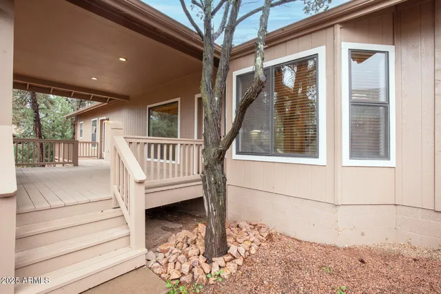 a view of an chairs and table in the balcony