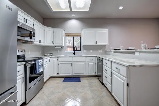 a view of cabinets and window