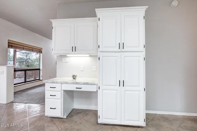 a kitchen with sink cabinets and window