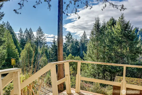 a view of a balcony with wooden floor
