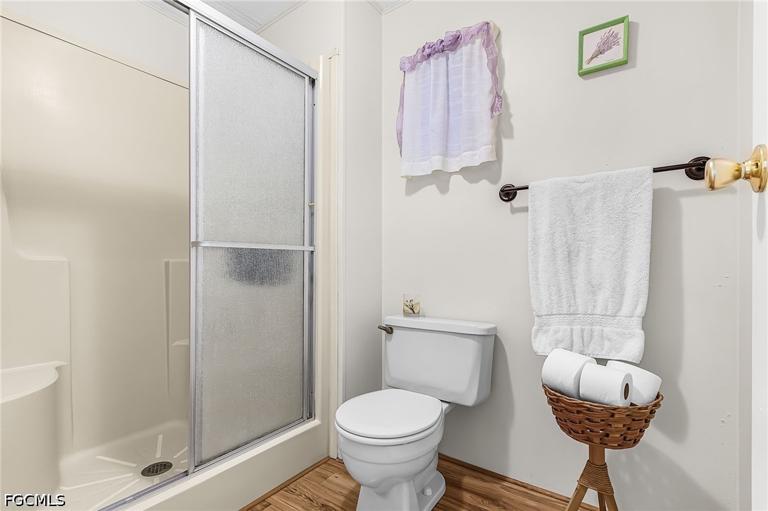 5 Erica Street Alva, FL 33920 - Photo 13 of 37 a bathroom with a toilet and a shower