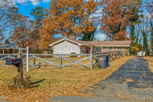 a view of house with outdoor space and sitting area