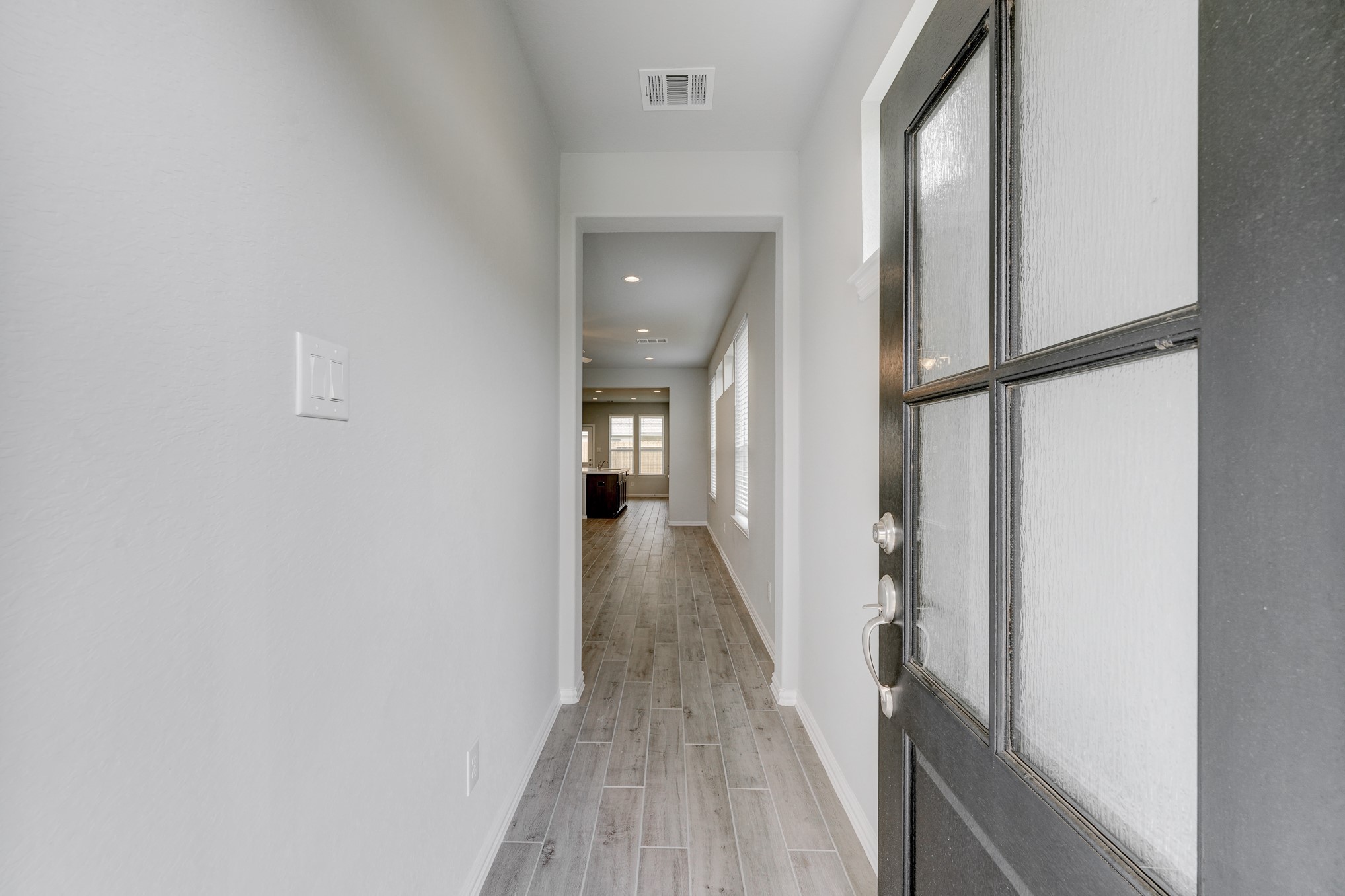 1229 Red Hills Drive Rosharon, TX 77583 - Photo 4 of 29 a view of a hallway with wooden floor and staircase