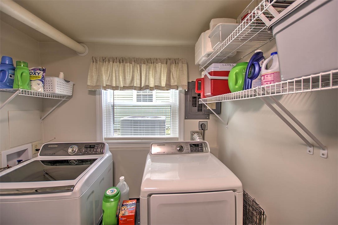 98 Ridgeway Drive Decatur, IL 62521 - Photo 19 of 31 a utility room with dryer and washer