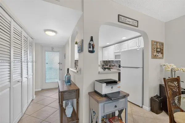a view of kitchen with furniture and wooden floor