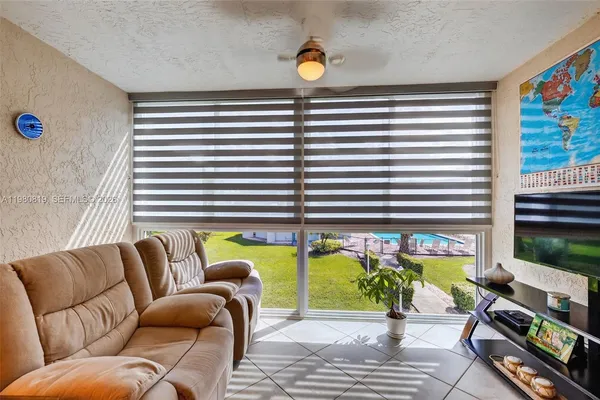 a view of a livingroom with furniture and window