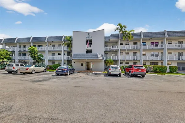 a view of an apartment with many windows